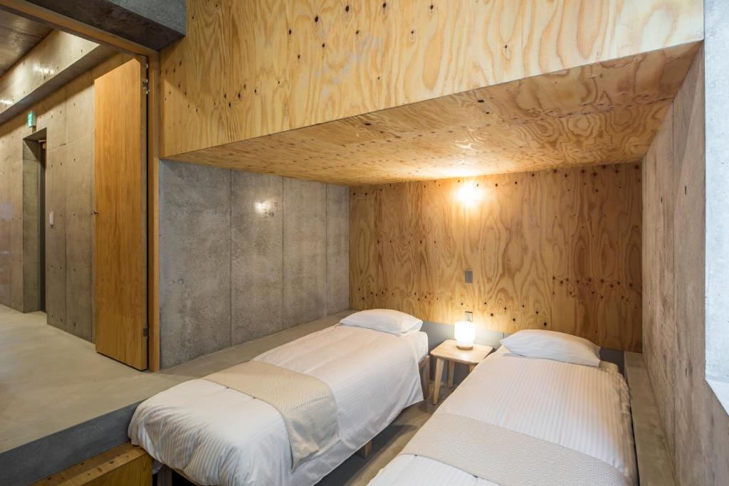 Postel nebo postele na pokoji v ubytování Smi:re Stay Oshiage