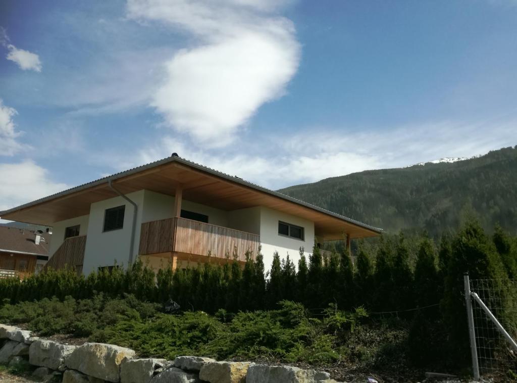 a house on the side of a mountain at Ferienwohnung Familie Alt Rinn, Innsbruck in Rinn