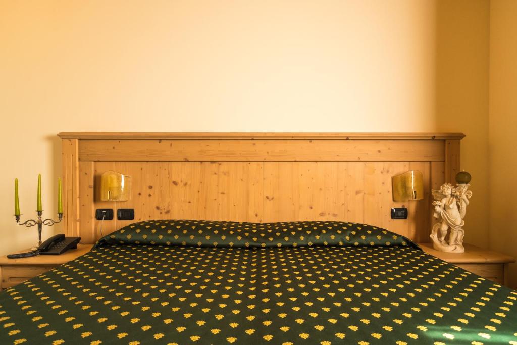 Postel nebo postele na pokoji v ubytování Hotel Dall'Ongaro