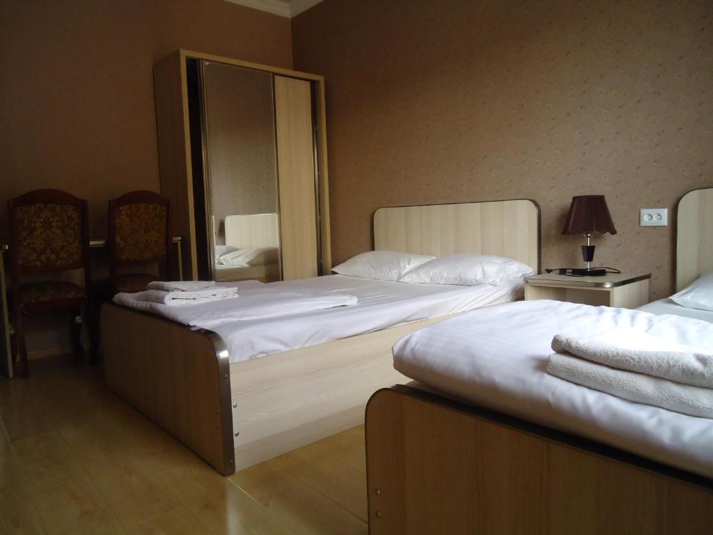 Postel nebo postele na pokoji v ubytování Hotel Nikala