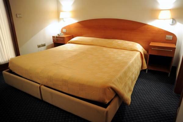 Postel nebo postele na pokoji v ubytování Hotel Vittoria