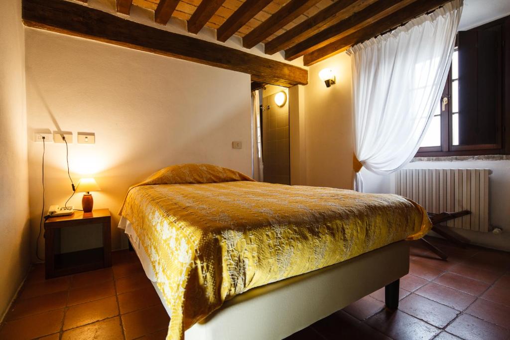 Posteľ alebo postele v izbe v ubytovaní Relais Fontevivo