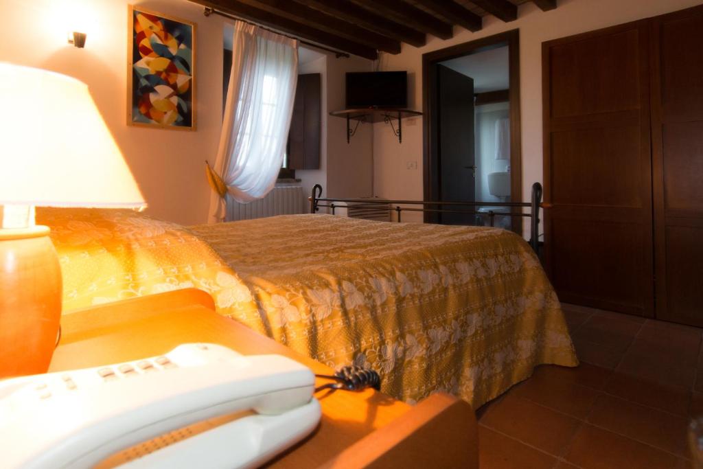 Posteľ alebo postele v izbe v ubytovaní Relais Fontevivo
