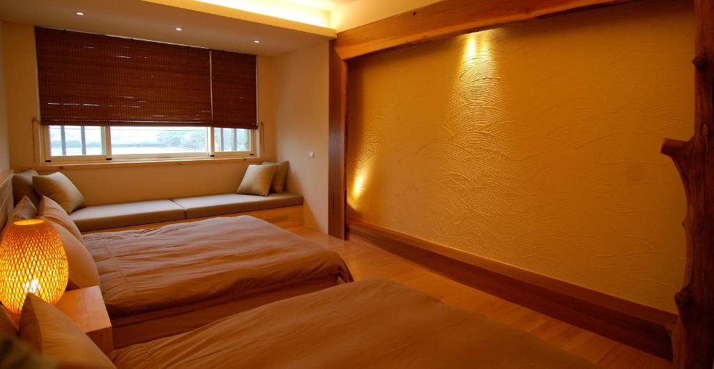 Postel nebo postele na pokoji v ubytování Taiori House