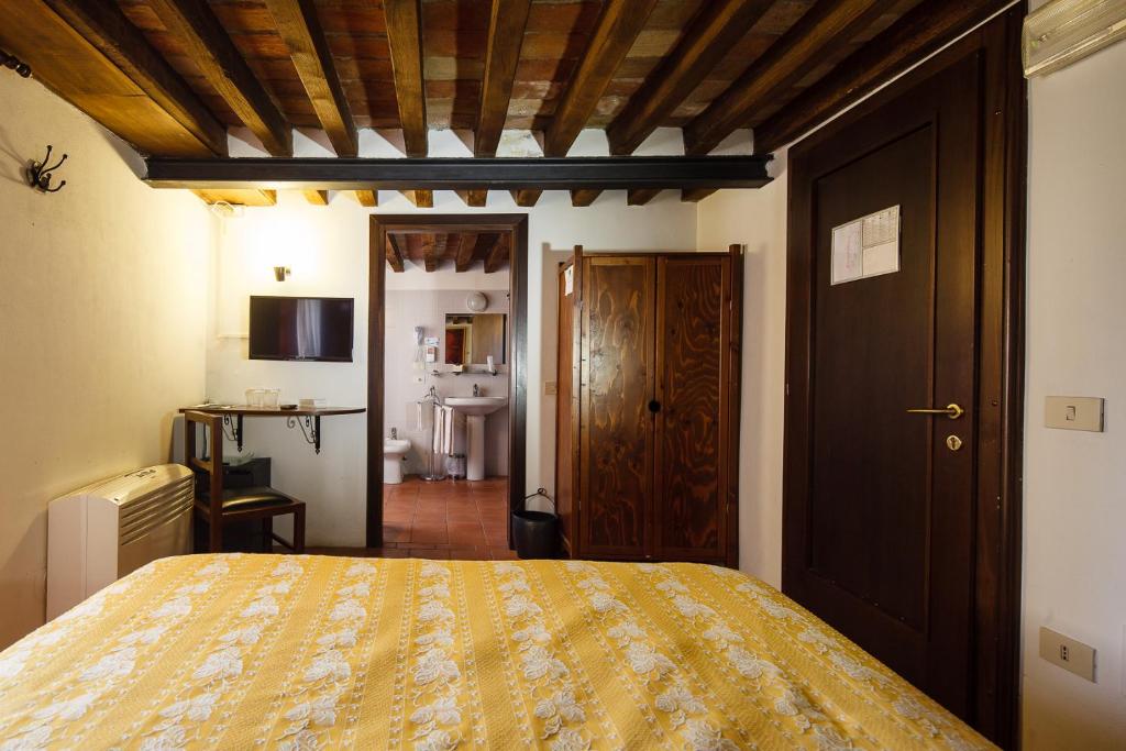 Posteľ alebo postele v izbe v ubytovaní Relais Fontevivo