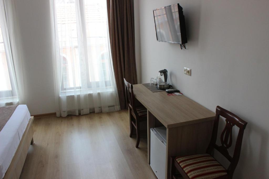 TV a/nebo společenská místnost v ubytování Hotel Varios