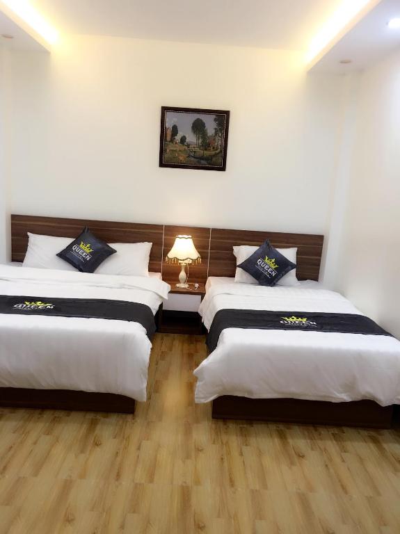 Postel nebo postele na pokoji v ubytování Queen Motel