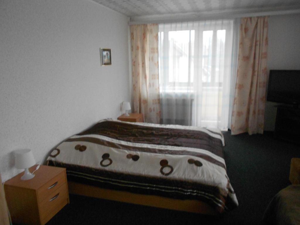 Postel nebo postele na pokoji v ubytování Jeruzale Hotel
