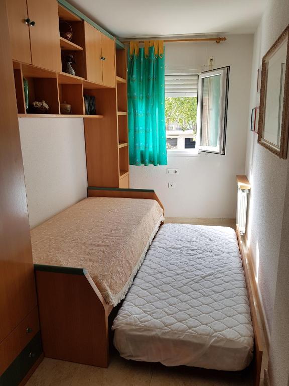 Posteľ alebo postele v izbe v ubytovaní El Pescador Park Cozy Apartment