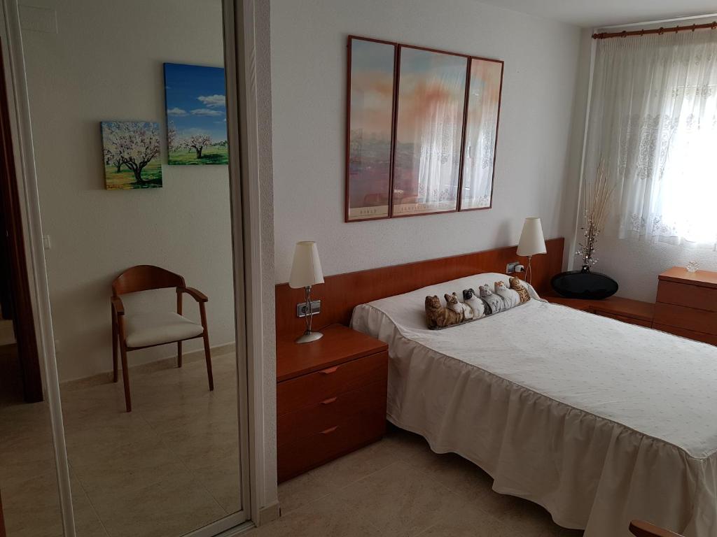 Posteľ alebo postele v izbe v ubytovaní El Pescador Park Cozy Apartment