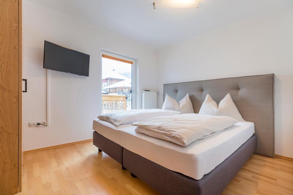 Postel nebo postele na pokoji v ubytování Stadlhof