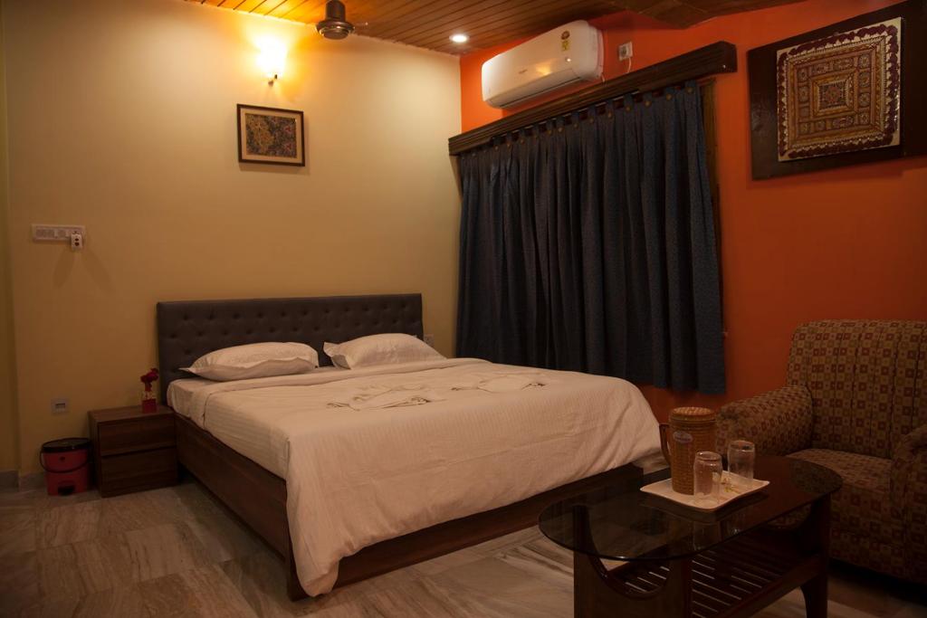 Postel nebo postele na pokoji v ubytování Om Sai Villa Guesthouse