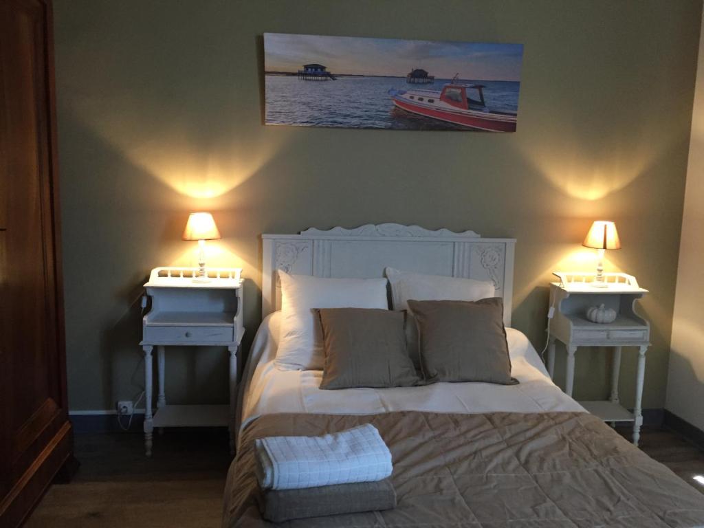 Un pat sau paturi într-o cameră la Villa des T