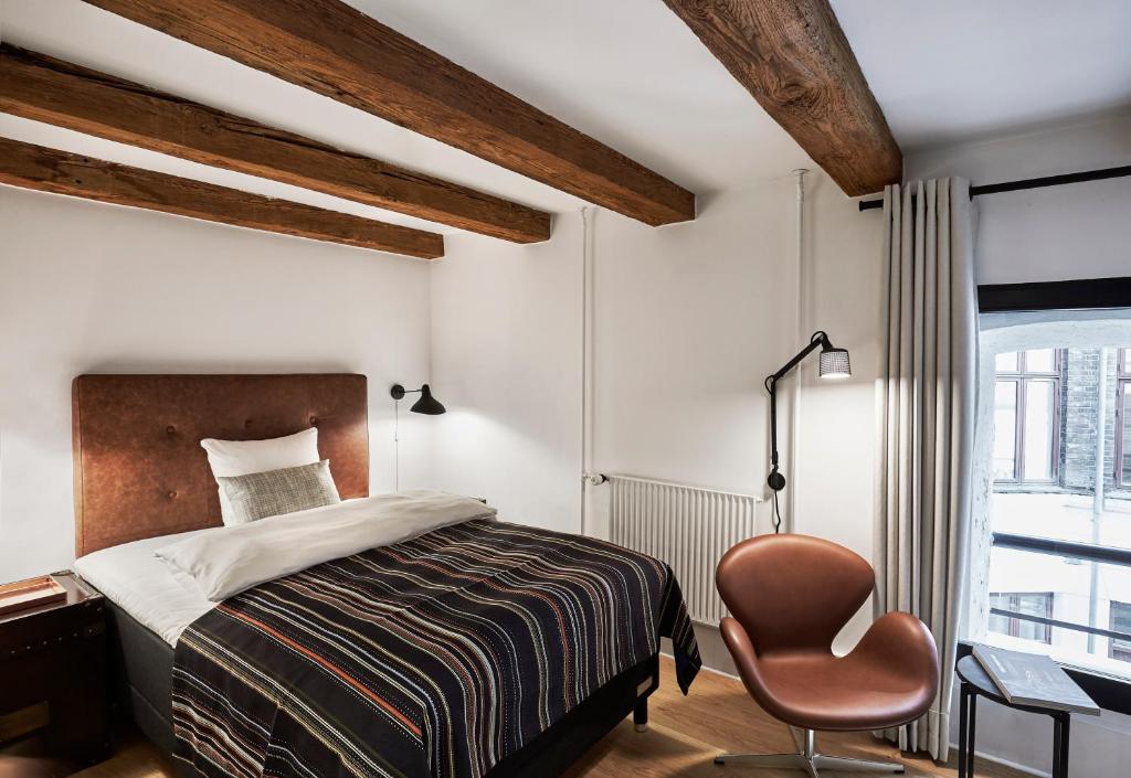 Una cama o camas en una habitación de 71 Nyhavn Hotel