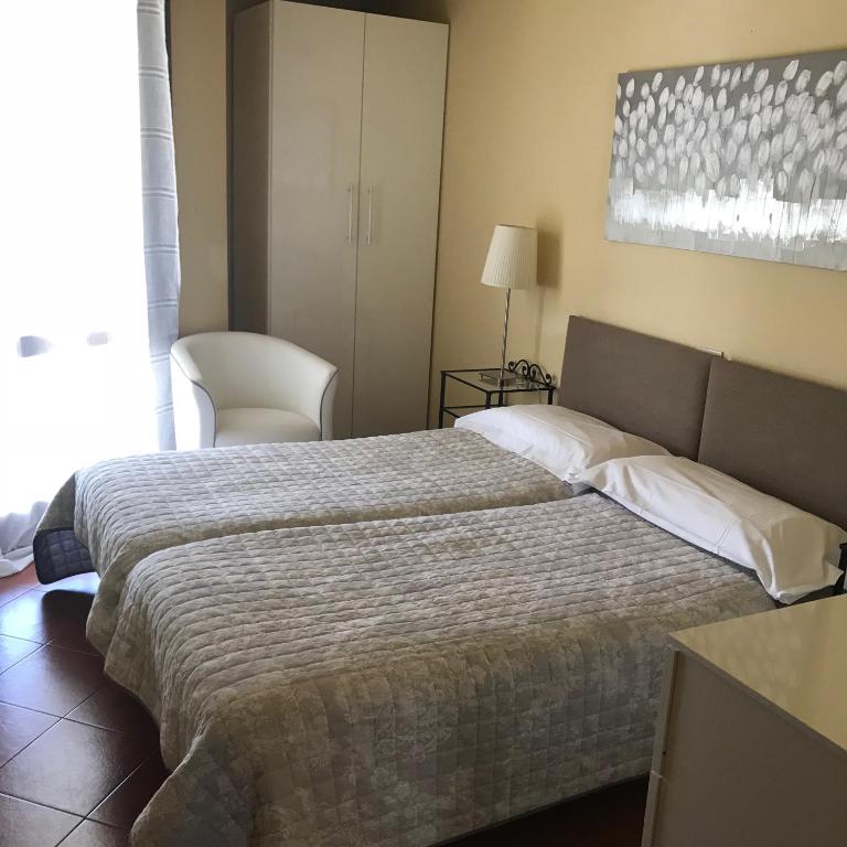 Postel nebo postele na pokoji v ubytování Claudio Appartamenti