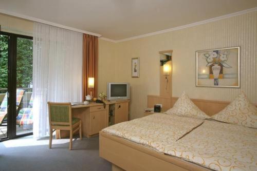 Postel nebo postele na pokoji v ubytování Hotel Dreyer Garni