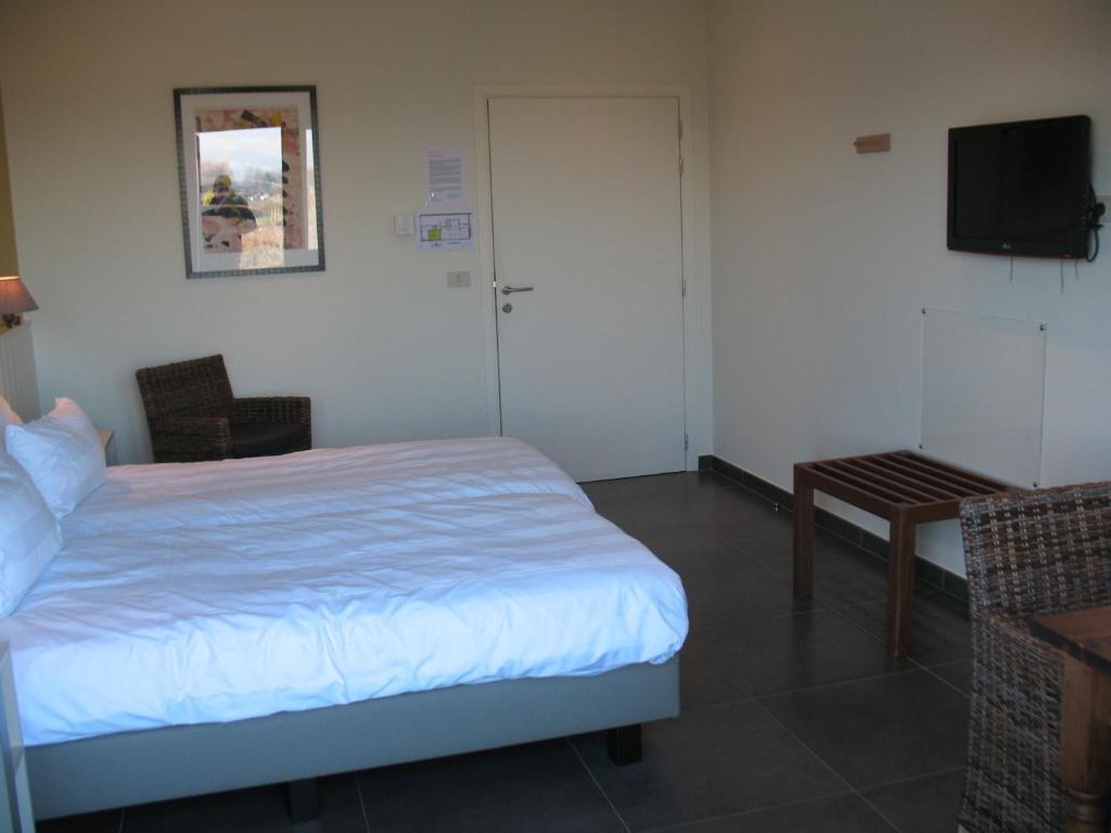 Postel nebo postele na pokoji v ubytování B&B La Vie En Roses