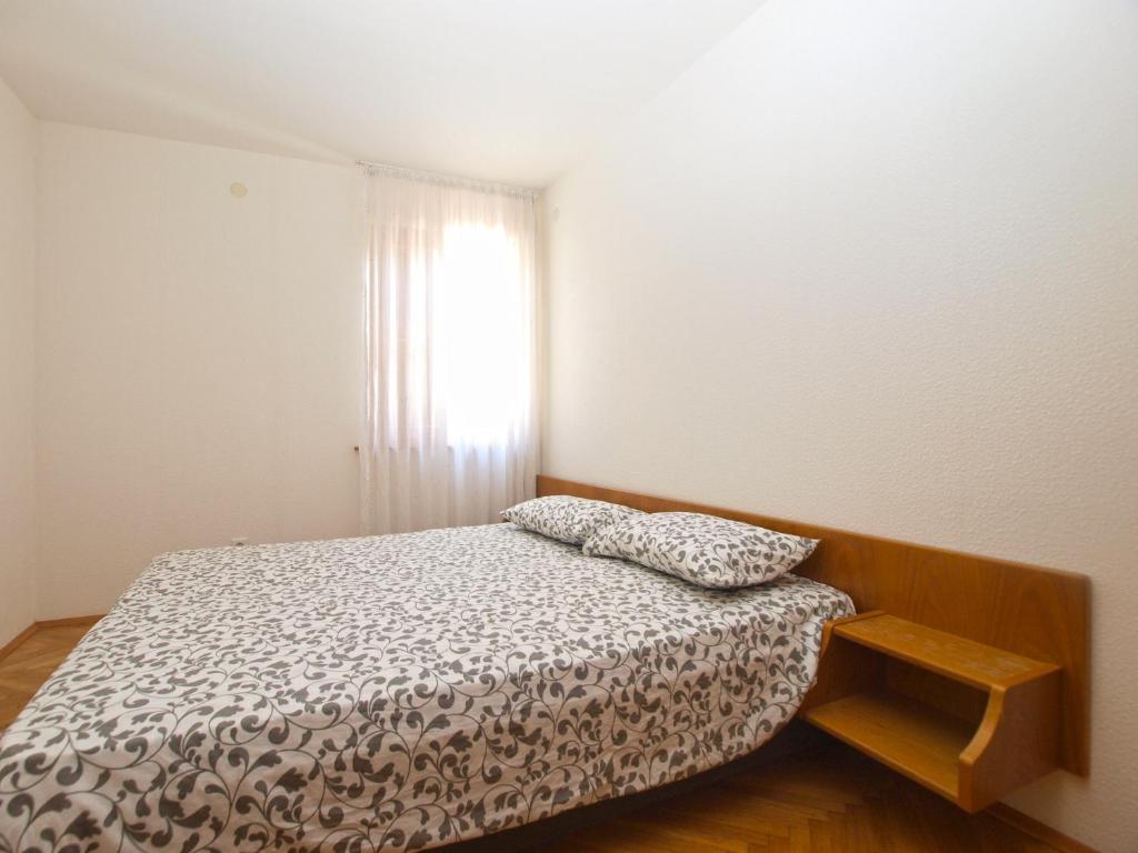 Postel nebo postele na pokoji v ubytování Apartments and rooms Novigrad 1624