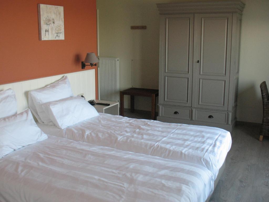 Postel nebo postele na pokoji v ubytování B&B La Vie En Roses