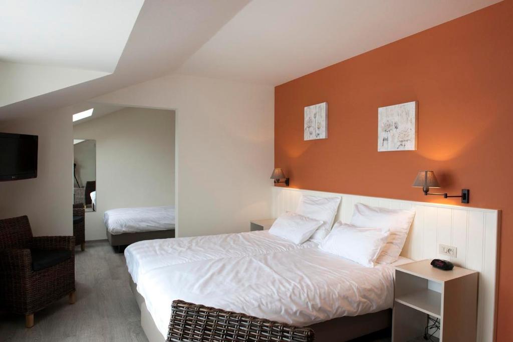 Postel nebo postele na pokoji v ubytování B&B La Vie En Roses