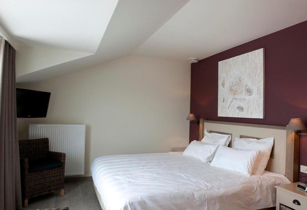 Postel nebo postele na pokoji v ubytování B&B La Vie En Roses
