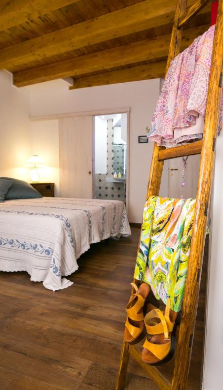 Postel nebo postele na pokoji v ubytování Casa di Nonno Mariano