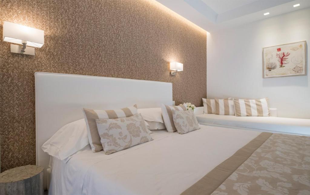 Łóżko lub łóżka w pokoju w obiekcie Hotel Mon Cheri