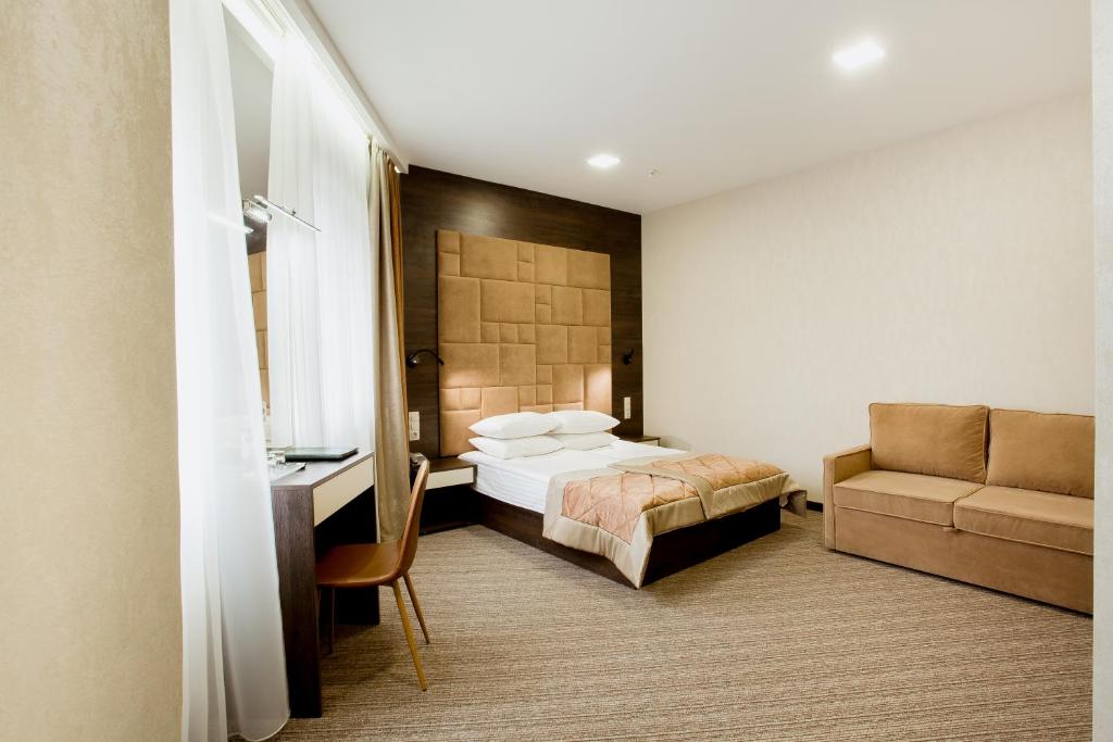 מיטה או מיטות בחדר ב-Hotel Natalia 18