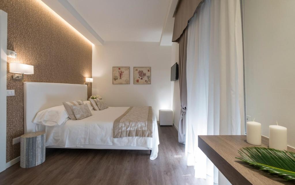 Łóżko lub łóżka w pokoju w obiekcie Hotel Mon Cheri