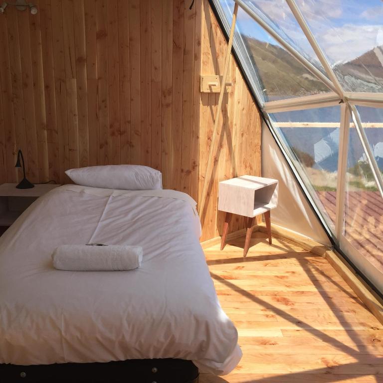 Postel nebo postele na pokoji v ubytování Terra Luna Lodge