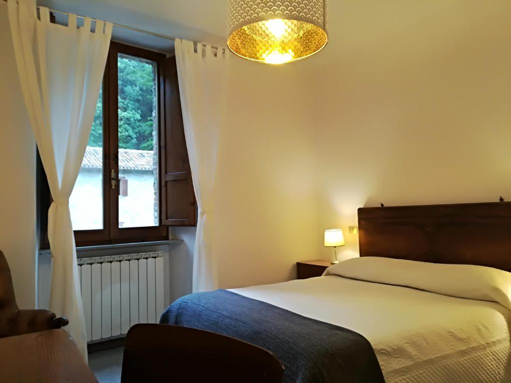 Postel nebo postele na pokoji v ubytování Civico 10