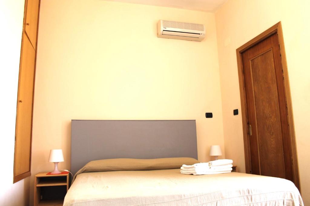 Postel nebo postele na pokoji v ubytování B&B Nettuno San Leone