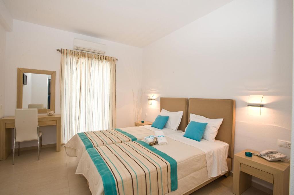 Postel nebo postele na pokoji v ubytování Zannis Hotel