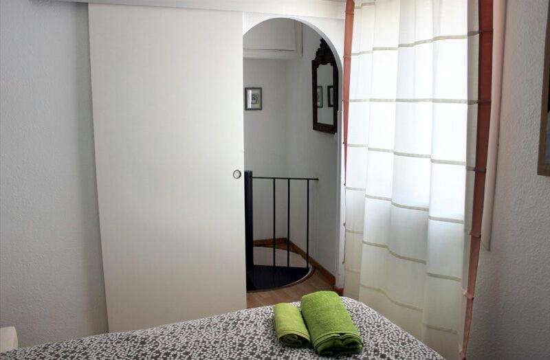 Postel nebo postele na pokoji v ubytování Mini Apartamento Port Aiguadolç