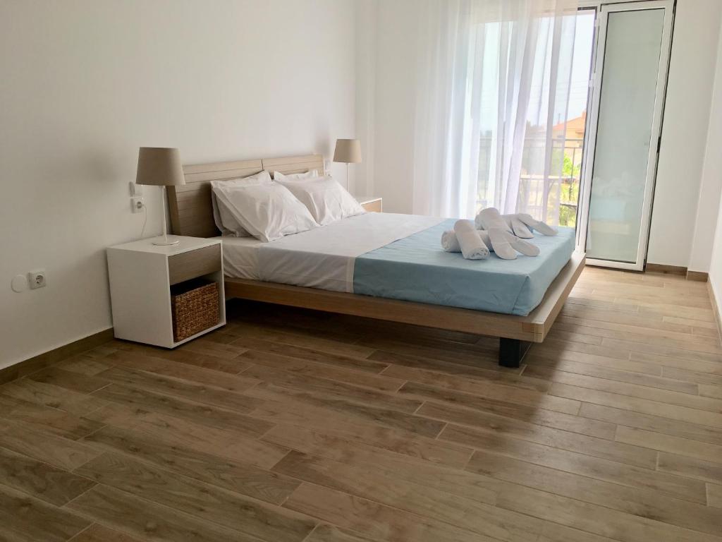Postel nebo postele na pokoji v ubytování Alegria Kefalonia