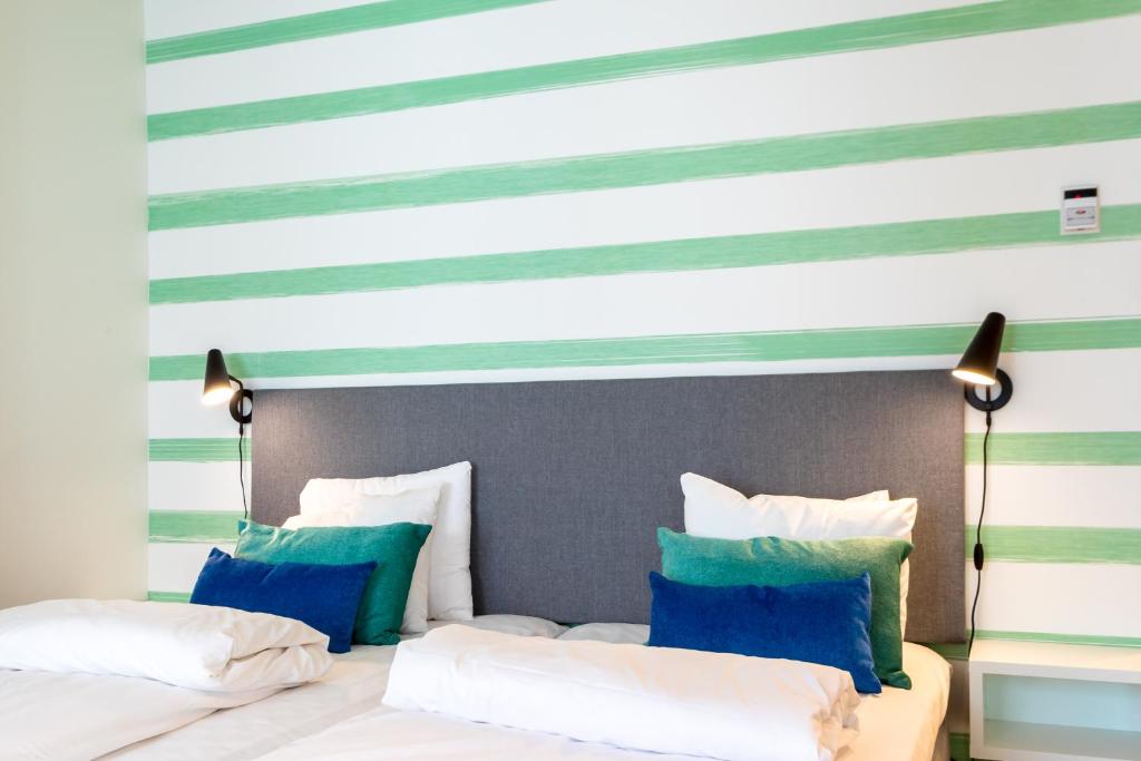 Postel nebo postele na pokoji v ubytování ApartDirect Hammarby Sjöstad