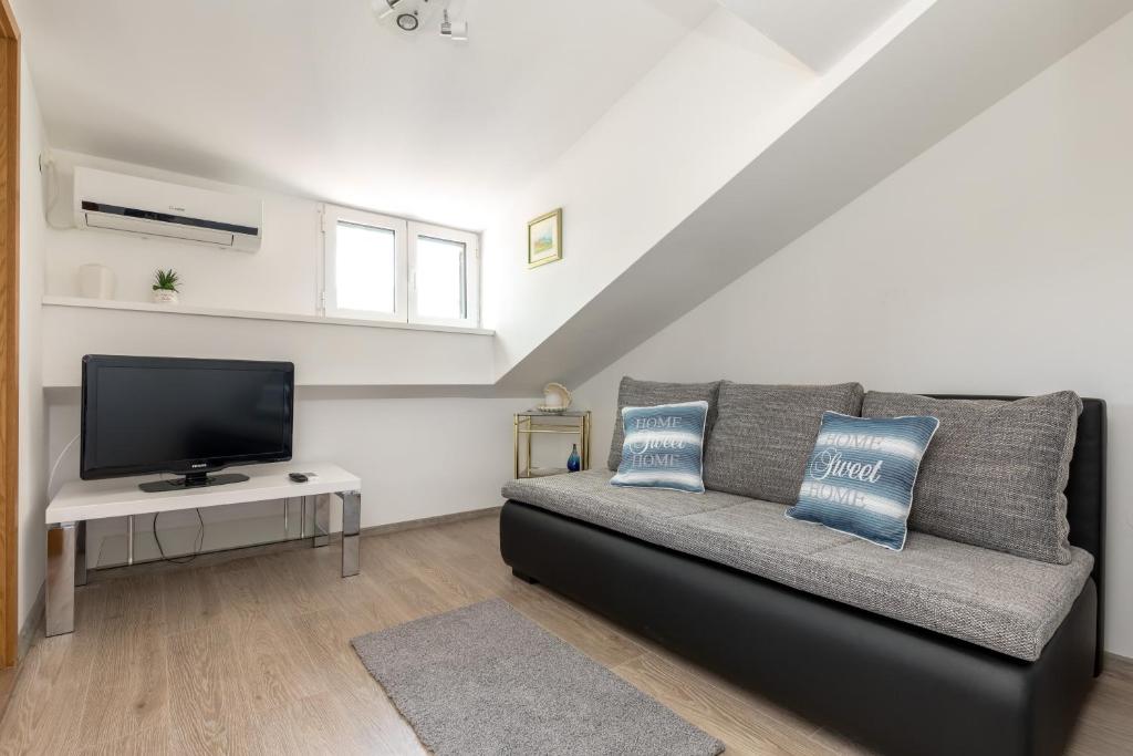 Televízia a/alebo spoločenská miestnosť v ubytovaní Apartmant Centar Split