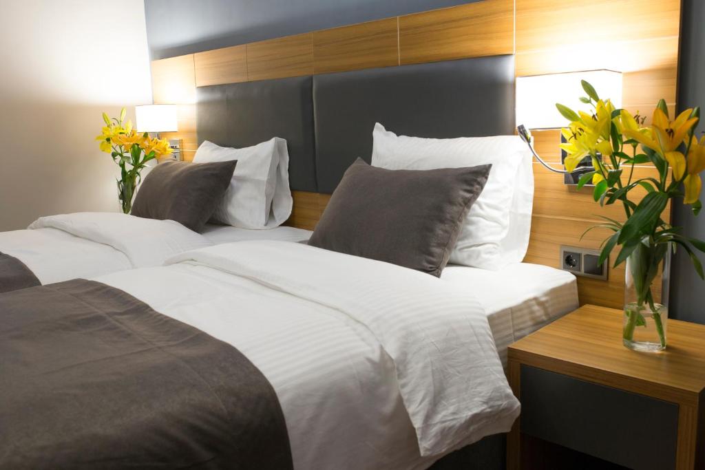 Postel nebo postele na pokoji v ubytování MD Barbaros Hotel