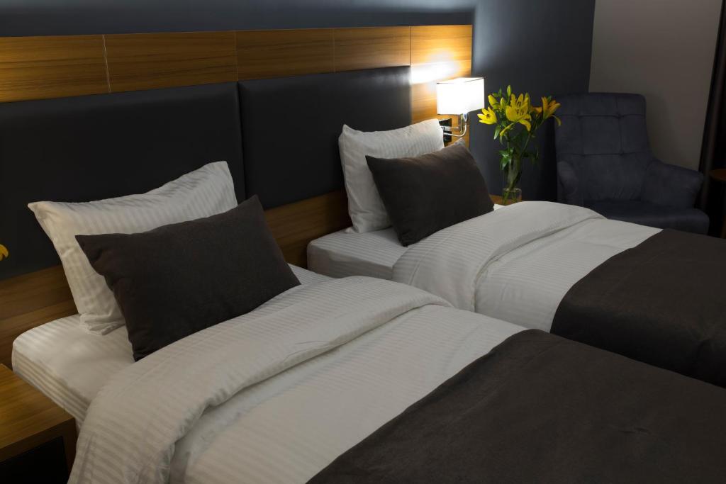 Postel nebo postele na pokoji v ubytování MD Barbaros Hotel
