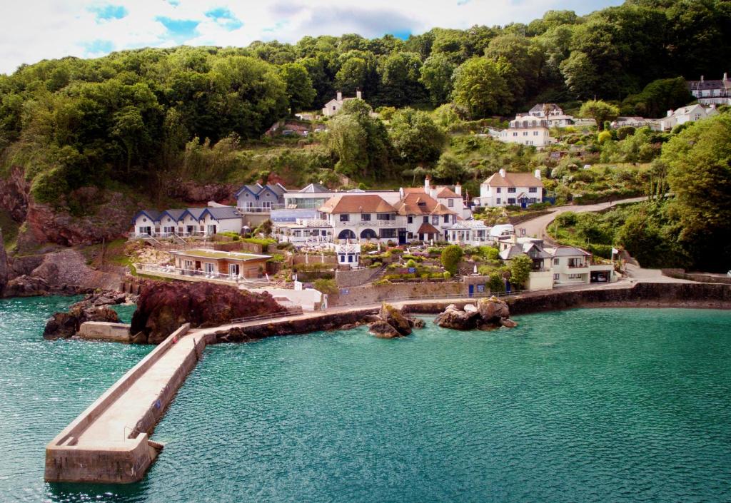 an aerial view of a house on the water at Cary Arms & Spa in Torquay