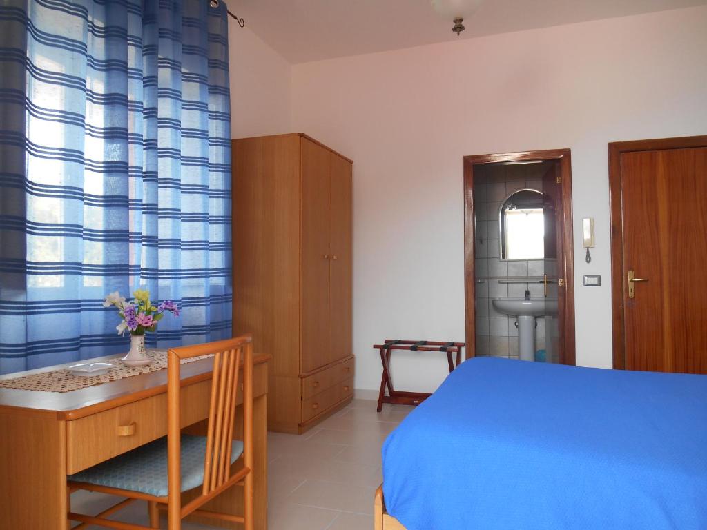 Postel nebo postele na pokoji v ubytování Albergo Villa Verde