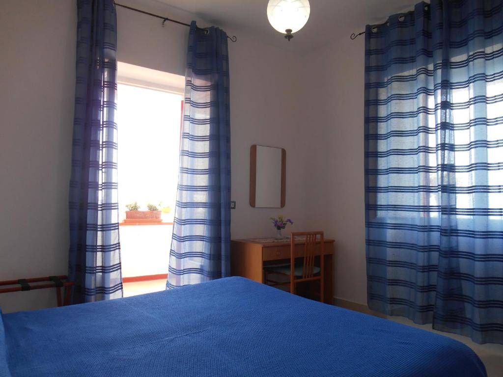Postel nebo postele na pokoji v ubytování Albergo Villa Verde