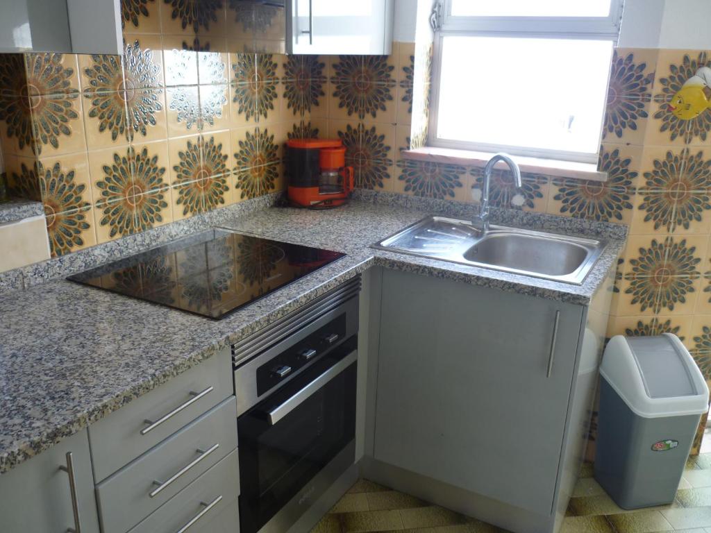 
A kitchen or kitchenette at São Gonçalo Apartment
