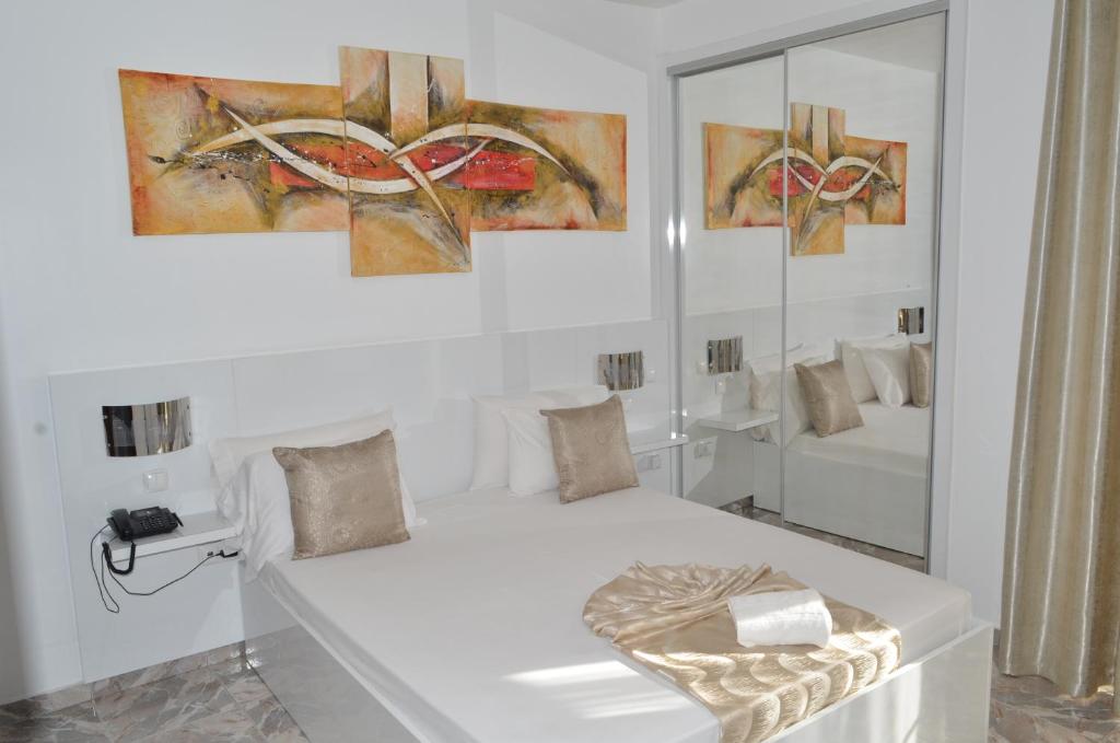 Postel nebo postele na pokoji v ubytování Hotel Cesaria