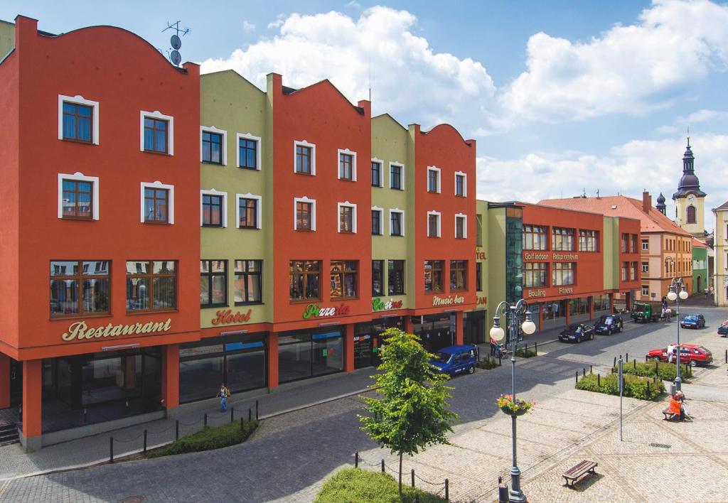 a row of buildings on a city street at Wellness Hotel Lužan in Rumburk