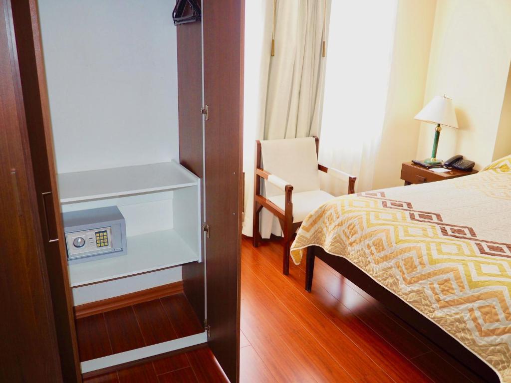 Postel nebo postele na pokoji v ubytování Hotel 6 De Diciembre