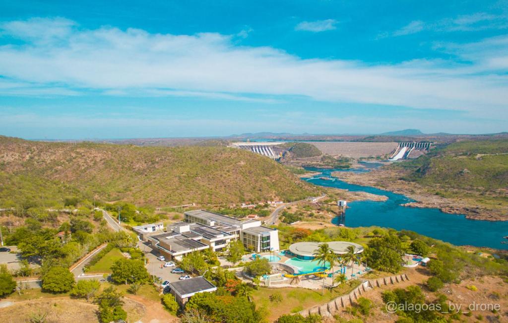 an aerial view of a dam with a river at Xingó Parque Hotel in Canindé de São Francisco