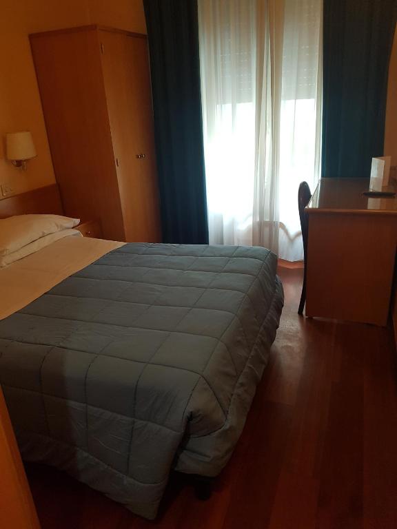 Posteľ alebo postele v izbe v ubytovaní Hotel Piemonte