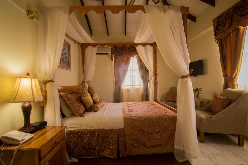 Postel nebo postele na pokoji v ubytování Hotel Alexandrina