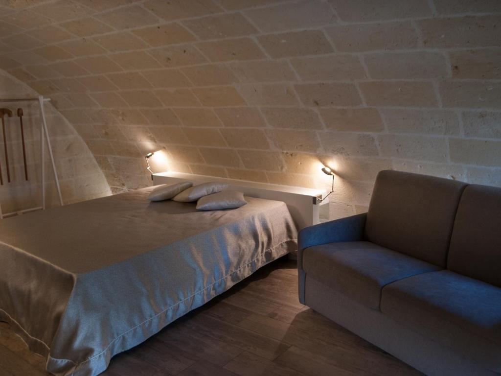 Postel nebo postele na pokoji v ubytování Recinto antico Sweet Rooms